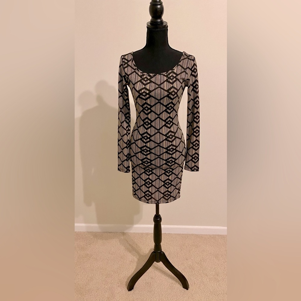 Black/ tan. Long sleeve dress. New with tags. Size S